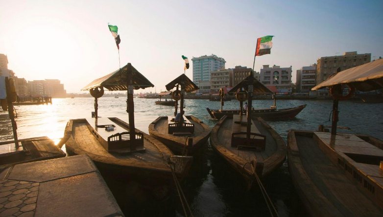 Traditional wooden boats docked along Dubai Creek