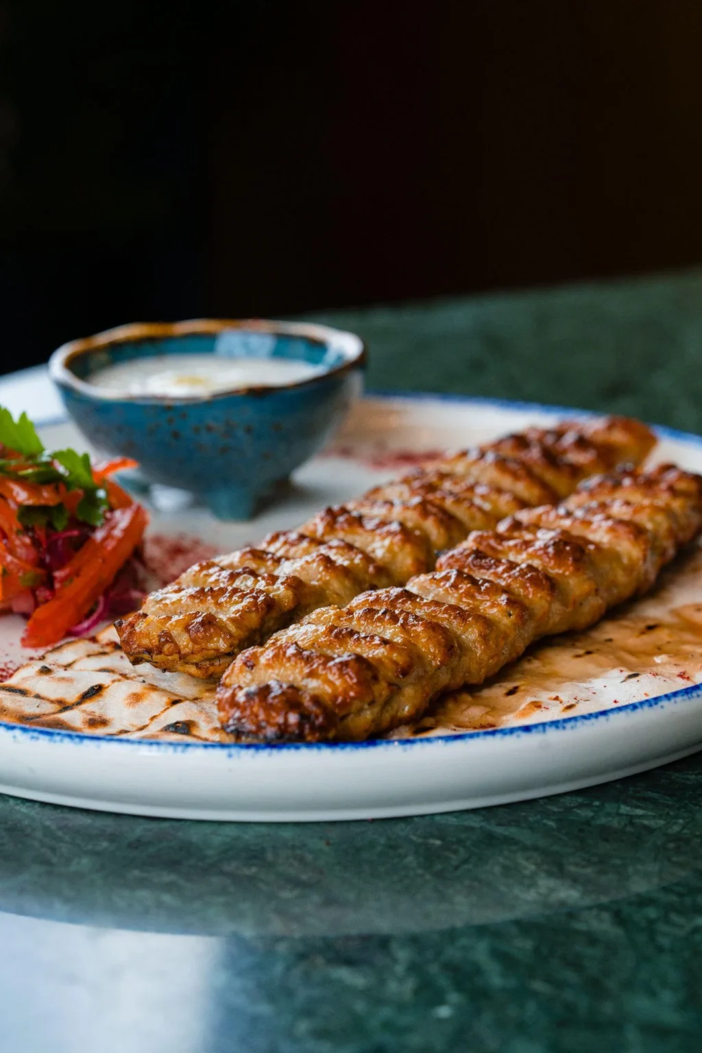 Enjoy the Persian Mixed Grilled Platter at Le Flamant Rose Restaurant in Dubai Creek Harbour