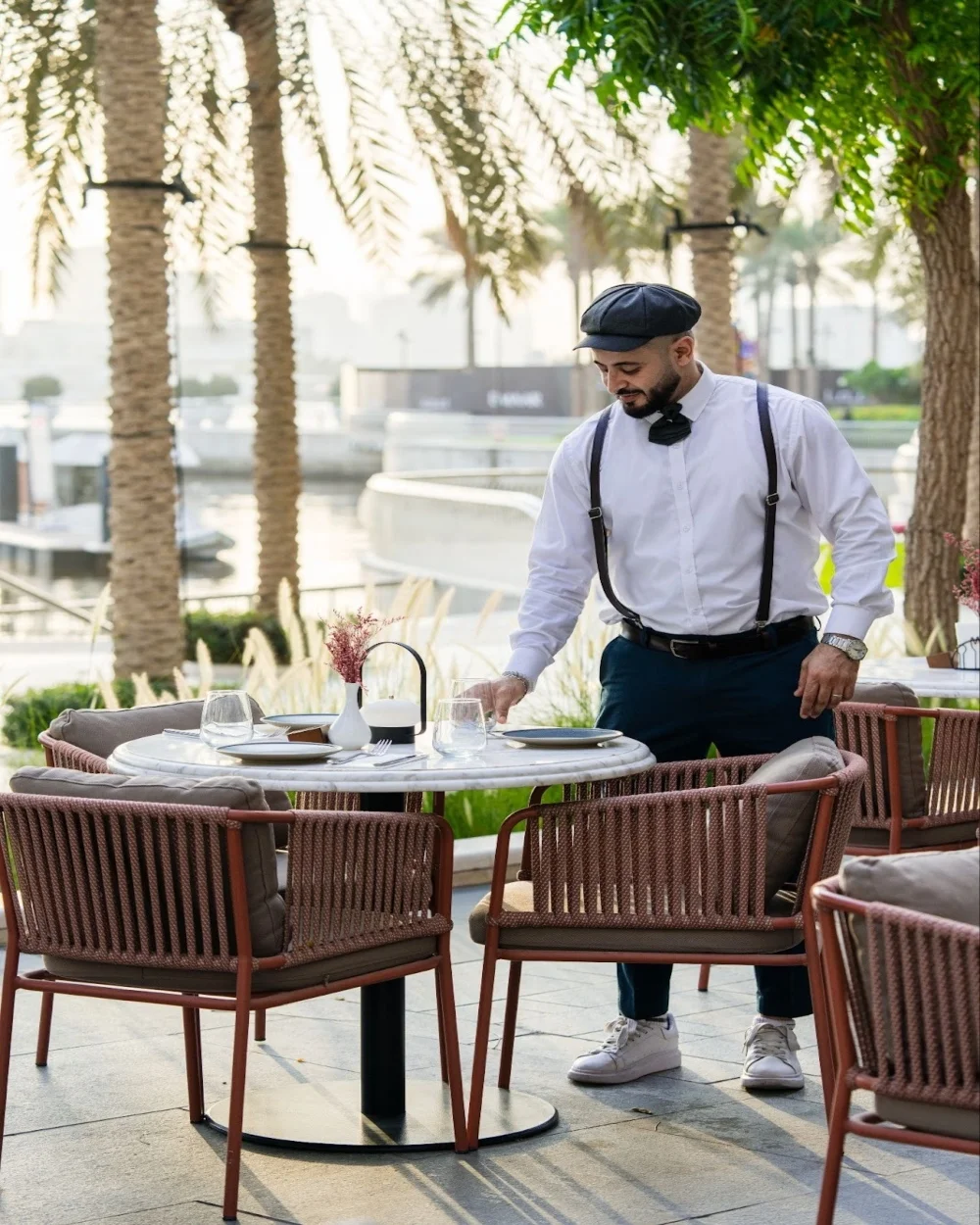 dining with a view, waiter setting up the table for dining