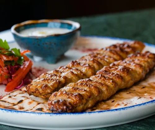 Enjoy the Persian Mixed Grilled Platter at Le Flamant Rose Restaurant in Dubai Creek Harbour